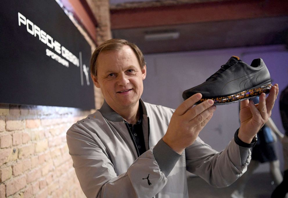 PHOTO: Bjoern Gulden, CEO of Puma, shows a shoe as the sports retailer presents its sportswear collection in collaboration with Porsche Design, in Berlin, Germany, February 21, 2019. 