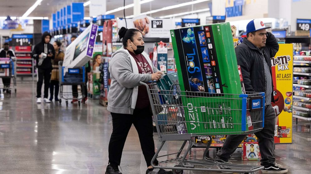 PHOTO: Shoppers pick up televisions and other Black Friday deals at a Wal-Mart on Nov 25, 2022 in Dunwoody, Ga.