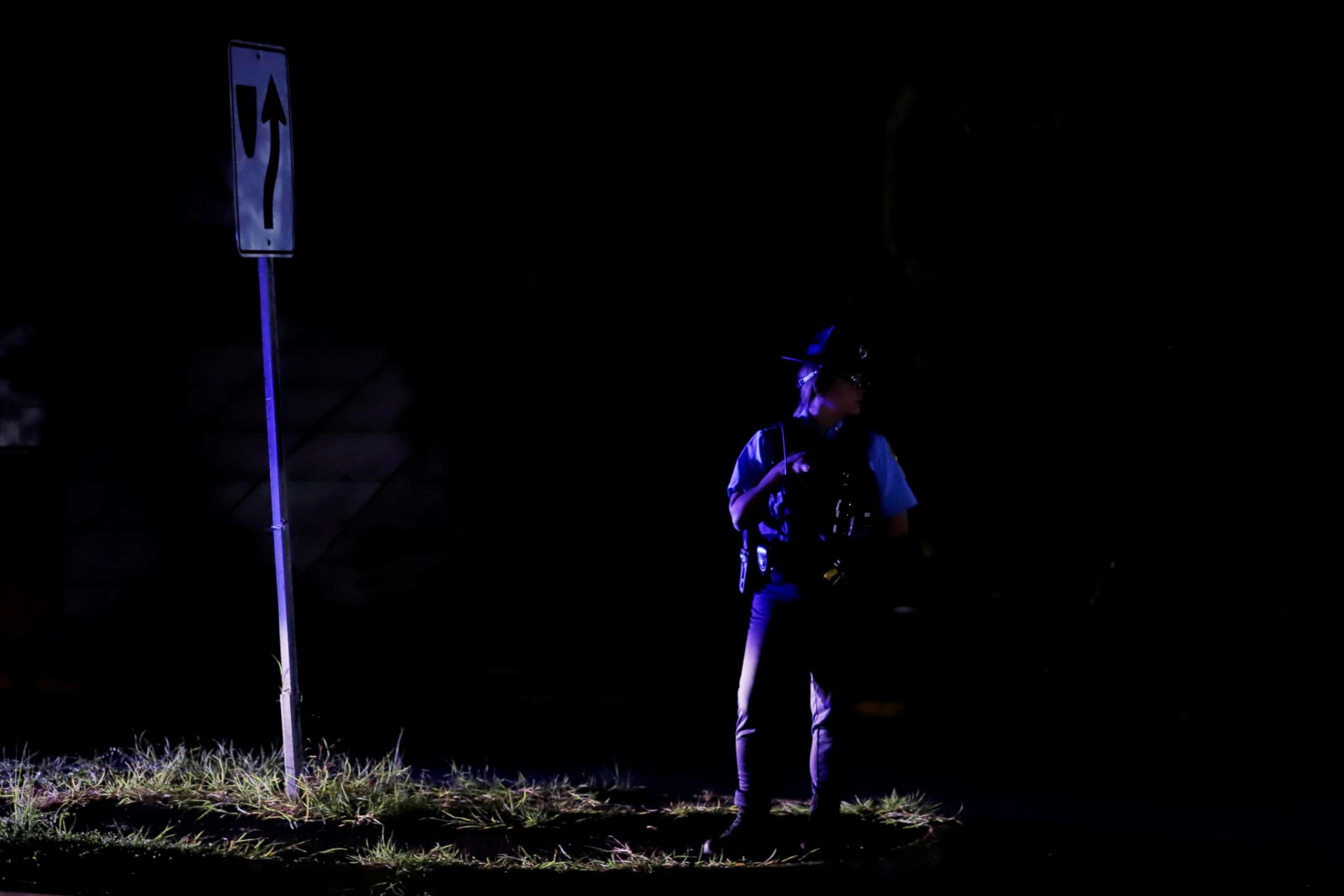 PHOTO: A policeman watches over the traffic in the dark after the fire registered in the Monacillos power substation, in San Juan, Puerto Rico, June 10, 2021.