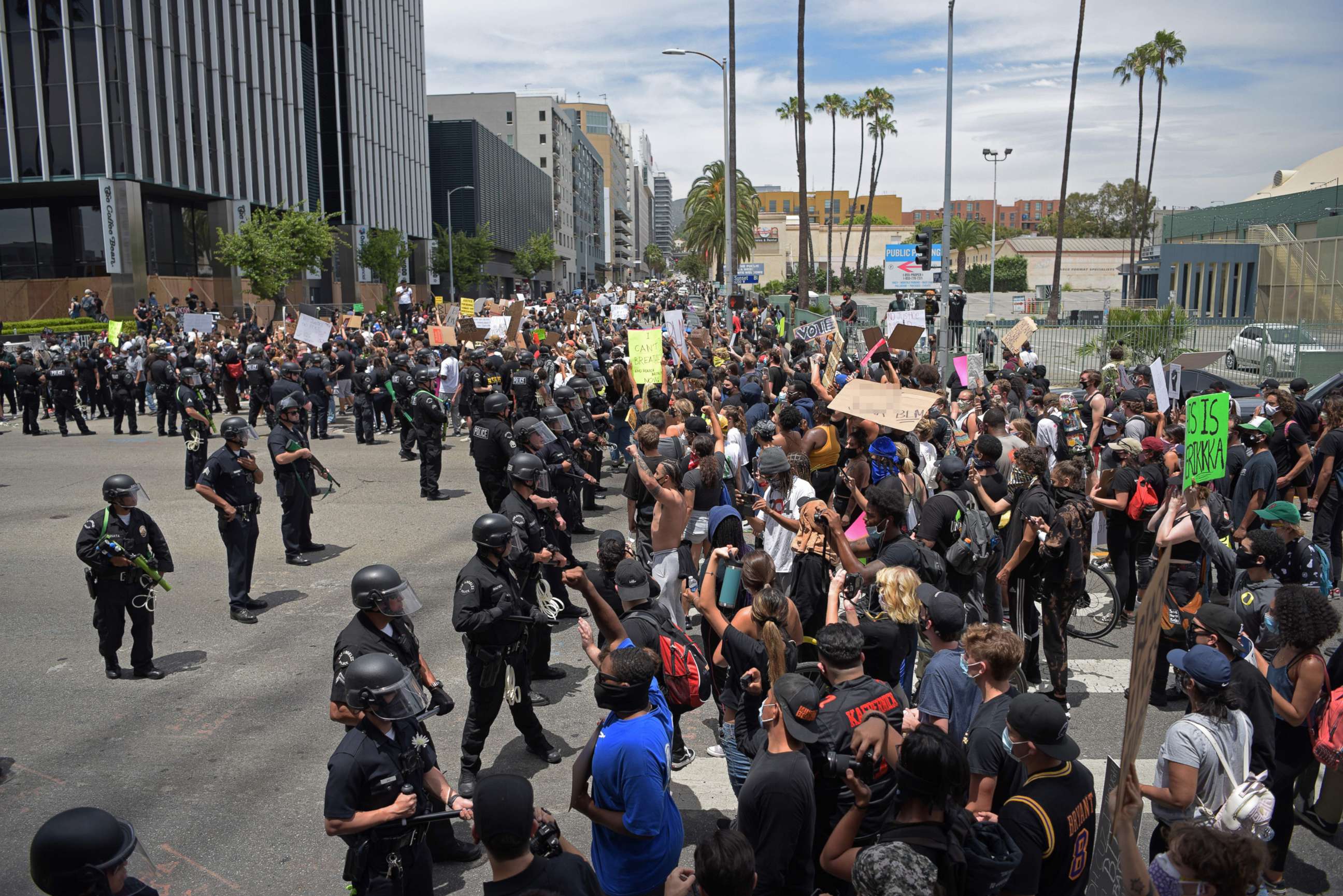 PHOTO: In this June 2, 2020, file photo, protestors gather in front of a row of LAPD officers during a demonstration over the death of George Floyd in Hollywood, Calif.