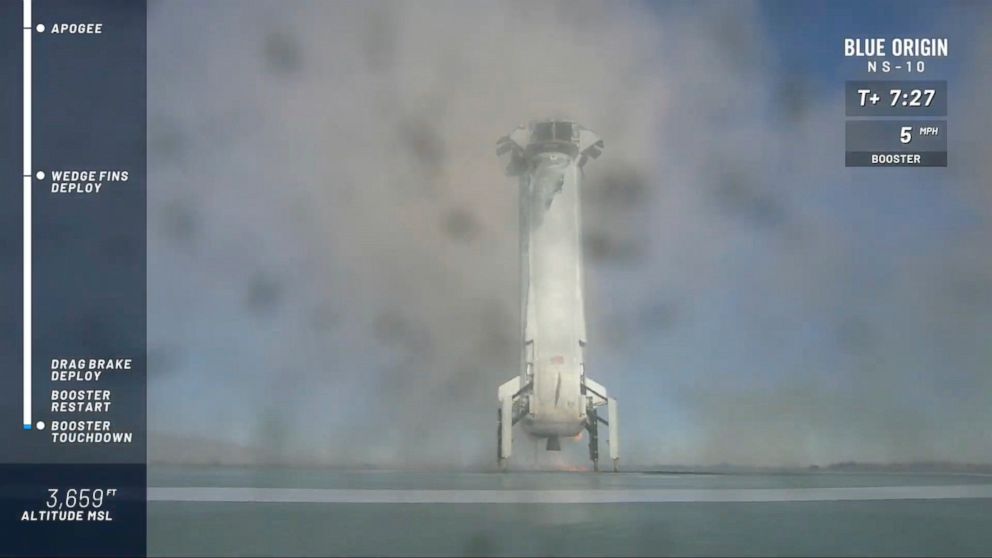 PHOTO: In this image from video made available by Blue Origin, the New Shepard booster lands the company's site in west Texas. 