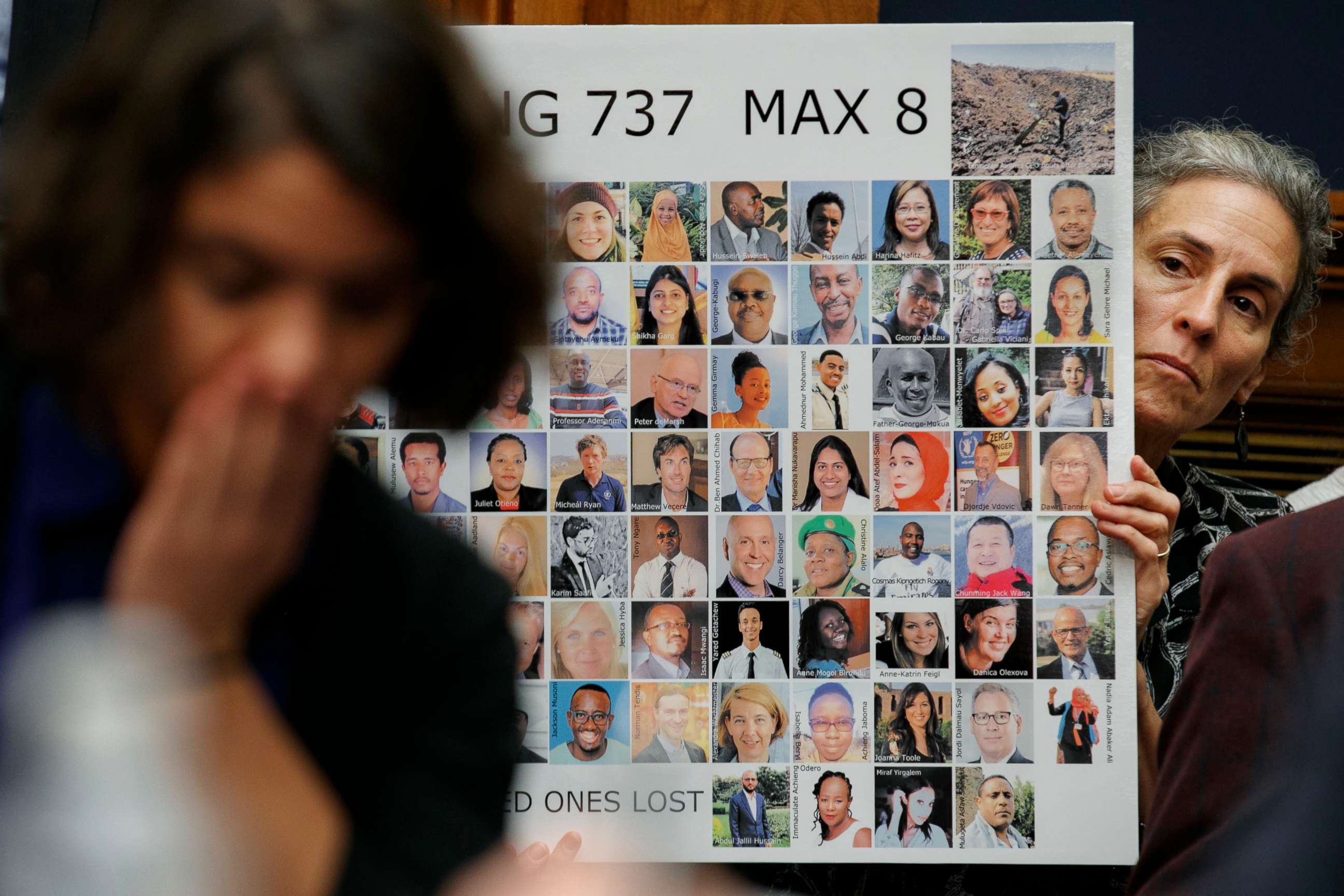 PHOTO: Nadia Milleron holds a sign depicting those killed in the Ethiopian Airlines Flight 302 crash, including her daughter, during a House Transportation and Infrastructure Committee hearing with Boeing executives, Oct. 30, 2019, in Washington.