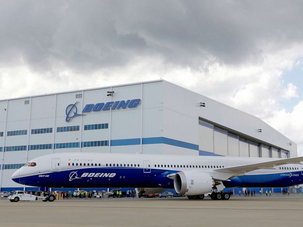 PHOTO: Boeing employees stand near the new Boeing 787-10 Dreamliner at the companys facility in South Carolina after conducting its first test flight at Charleston International Airport in North Charleston, S.C., March 31, 2017.