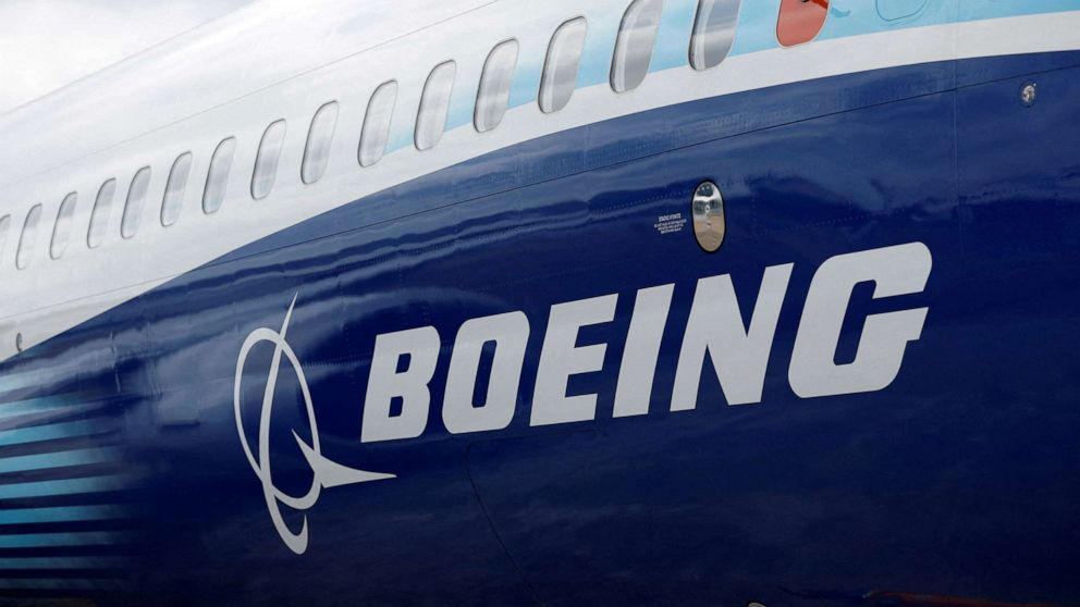 PHOTO: The Boeing logo is seen on the side of a Boeing 737 MAX at the Farnborough International Airshow in Farnborough, Britain, July 20, 2022.