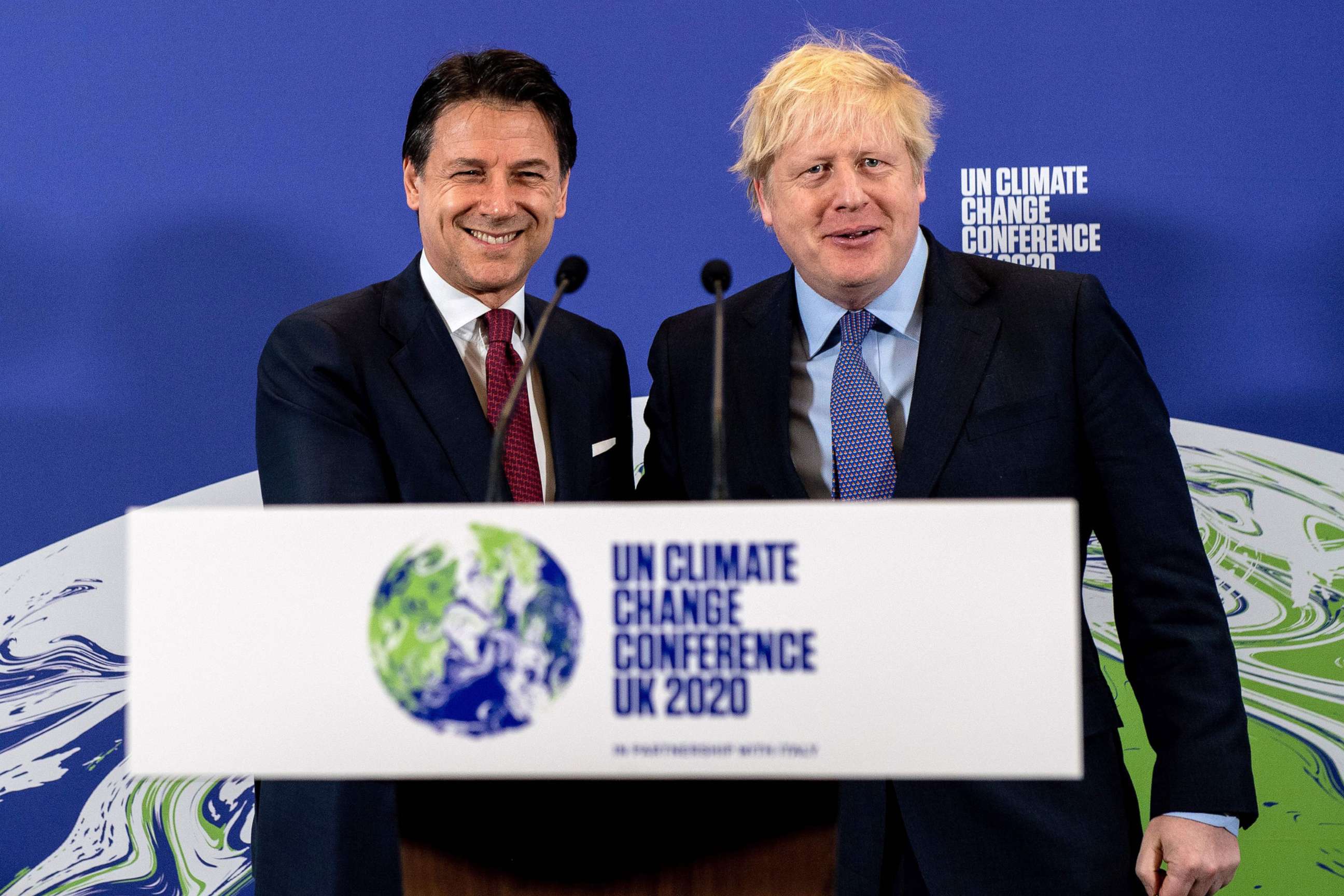 PHOTO: Britain's Prime Minister Boris Johnson and Italy's Prime Minister Giuseppe Conte shakes hands during an event to launch the United Nations' Climate Change conference, COP26, in central London on Feb. 4, 2020.