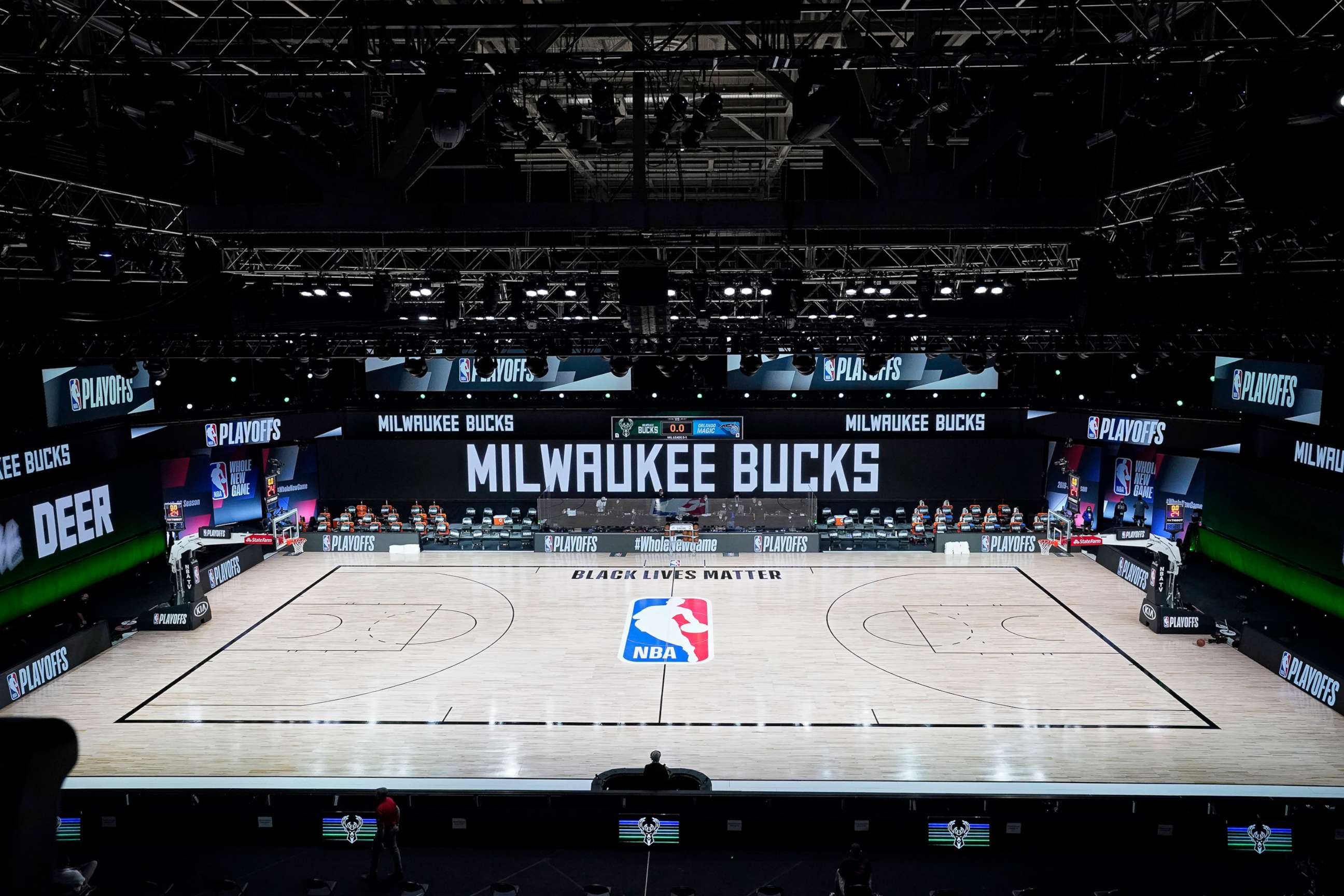 PHOTO: The court and benches are empty at the scheduled start of an NBA basketball  playoff game between the Milwaukee Bucks and the Orlando Magic in Lake Buena Vista, Fla., Aug. 26, 2020.