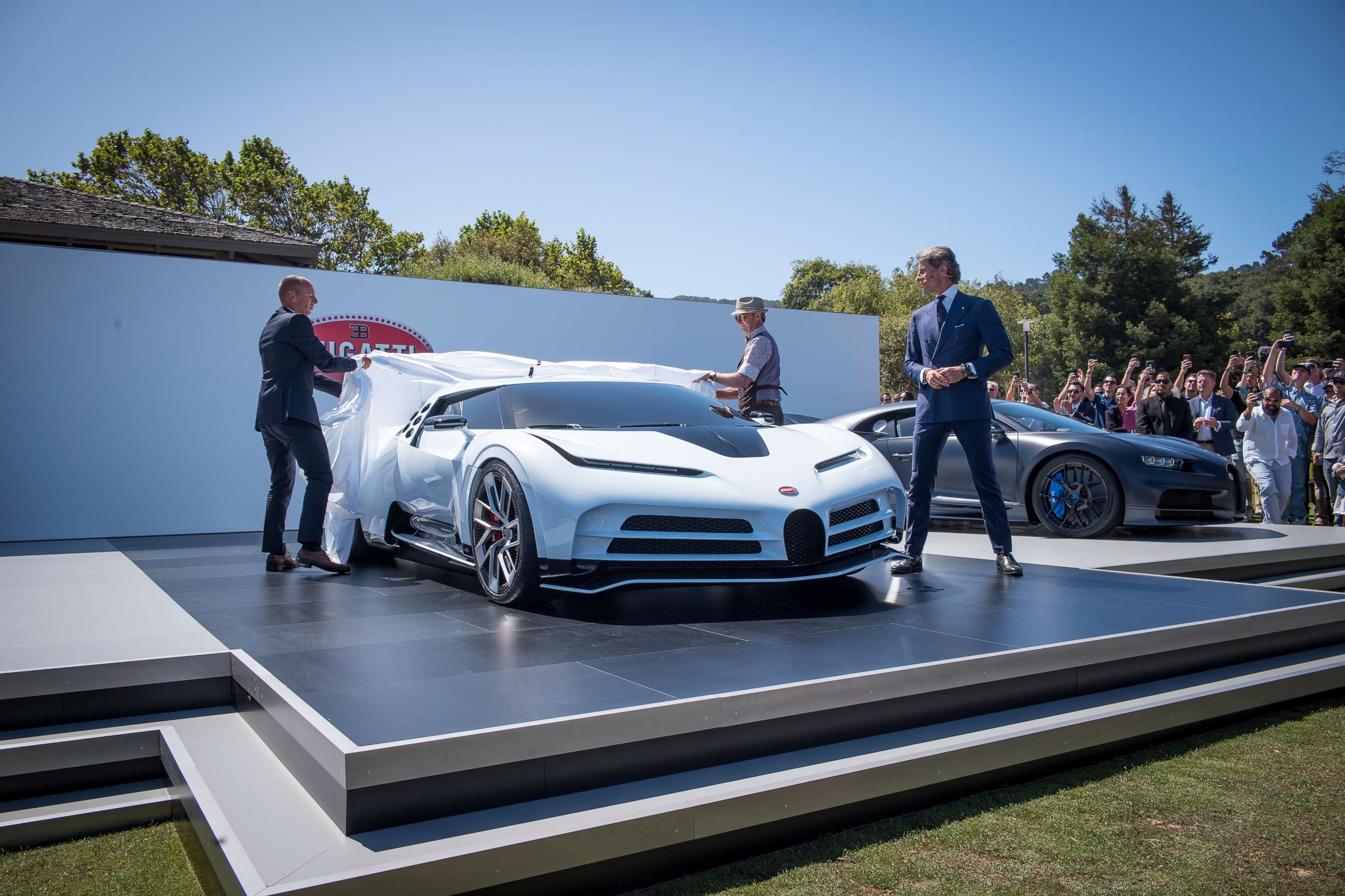 PHOTO: Stephan Winkelmann, president of Bugatti Automobiles SAS, right, watches the unveiling of the company's limited-edition Centodieci supercar in Carmel, Calif., Aug. 16, 2019.