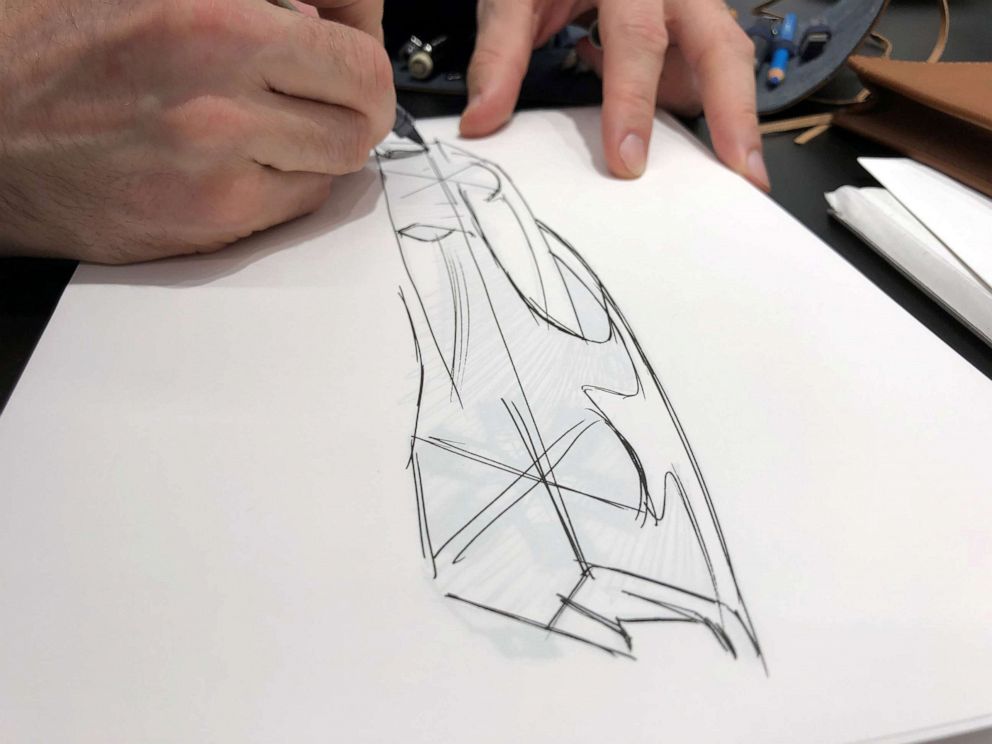 PHOTO: Etienne Salome doing what he loves most: sketching cars.