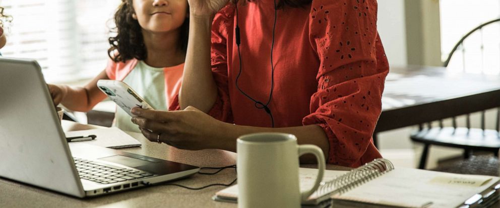 PHOTO: A mom works from home in a stock photo.