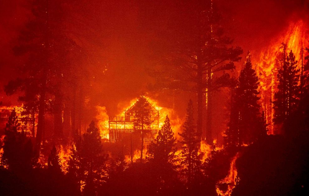 PHOTO: Flames consume multiple homes as the Caldor fire pushes into the Echo Summit area, California, Aug. 30, 2021.