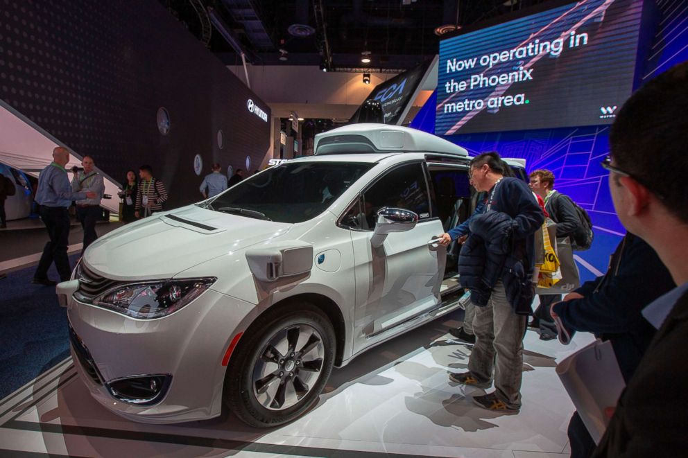 PHOTO: People look at the Waymo car, formerly the Google self-driving car project, during CES 2019 in Las Vegas, Jan. 9, 2019.