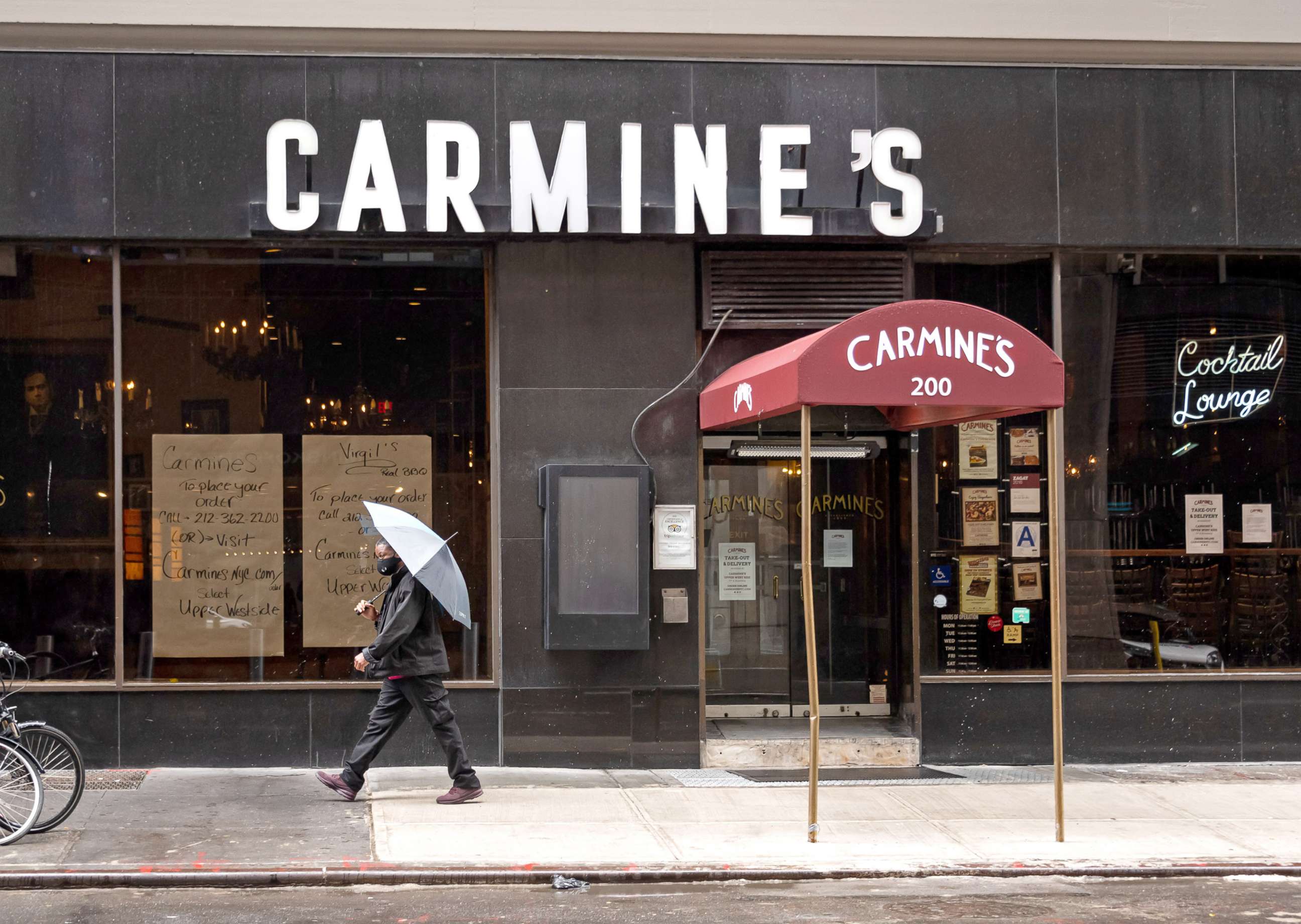 PHOTO: A person walks outside Carmine's Italian Restaurant in Times Square on Oct. 13, 2020 in New York City.