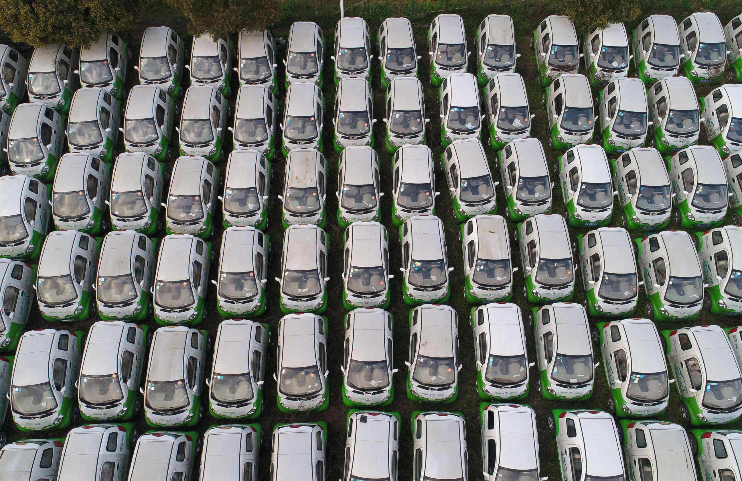 PHOTO: Aerial view of shared electric cars at a parking lot by the Qiantang River on March 23, 2019 in Hangzhou, China.