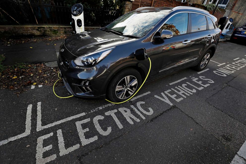 PHOTO: An electric car charges on a street recharging port in London, Nov. 18, 2020.