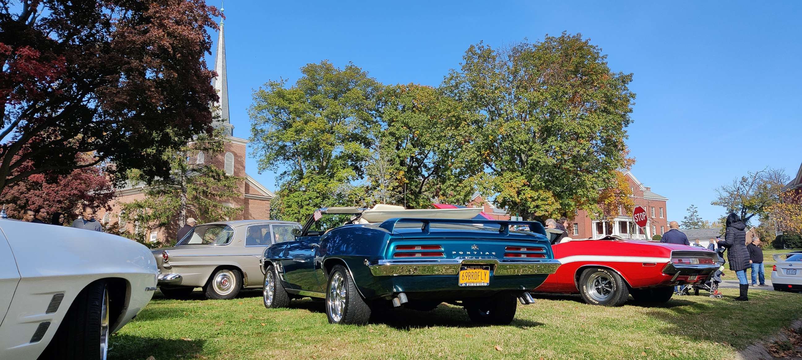 PHOTO: A Pontiac Firebird and a Dodge Challenger are seen at a classic car show in Queens, N.Y., November 2021.