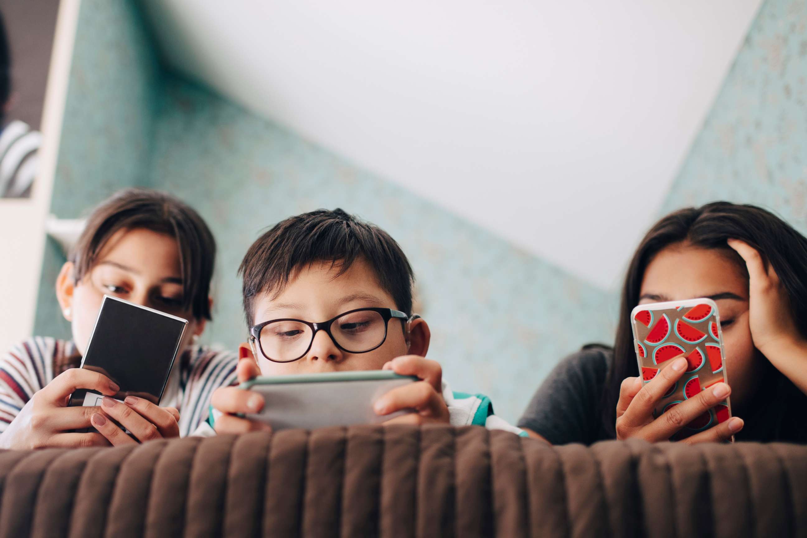 PHOTO: In this undated file photo, children look at their digital devices.