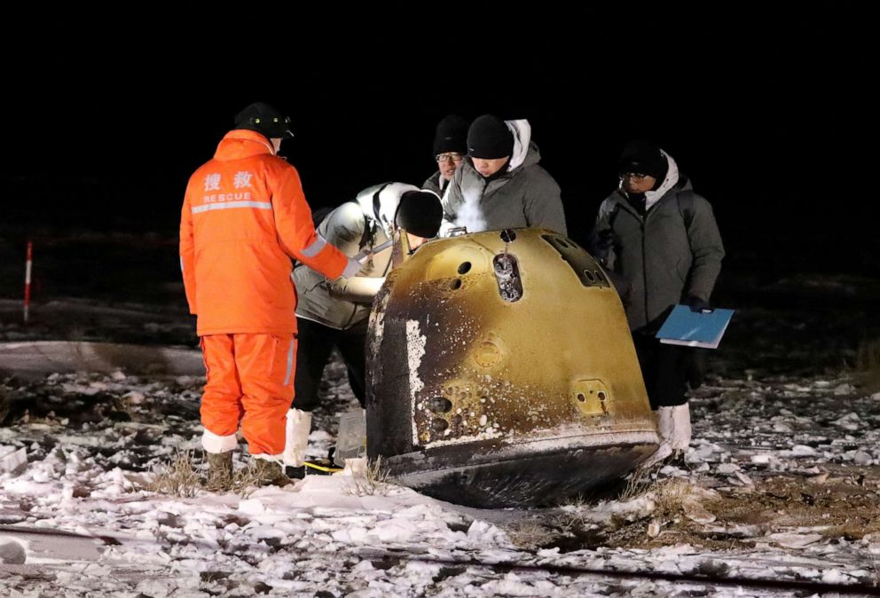 PHOTO: Researchers work next to Chang'e-5 lunar return capsule carrying moon samples, after it landed in northern China's Inner Mongolia Autonomous Region, Dec. 17, 2020.