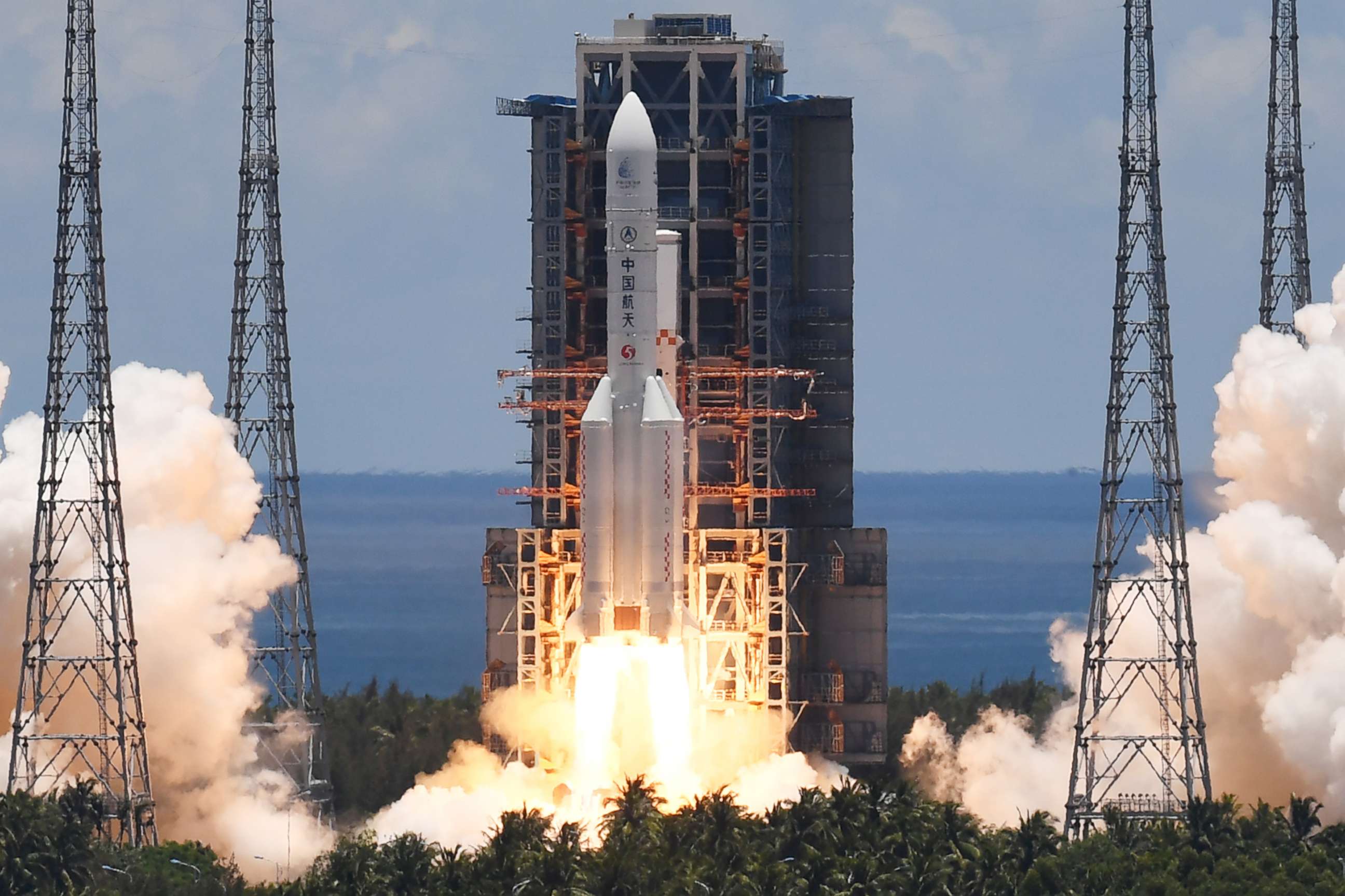 PHOTO: A Long March-5 rocket, carrying an orbiter, lander and rover as part of the Tianwen-1 mission to Mars, lifts off from the Wenchang Space Launch Center in southern China's Hainan Province on July 23, 2020.