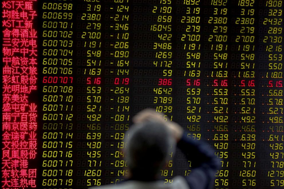 PHOTO: A man rubs his forehead as he monitors stock prices at a brokerage house in Beijing, Monday, May 13, 2019.