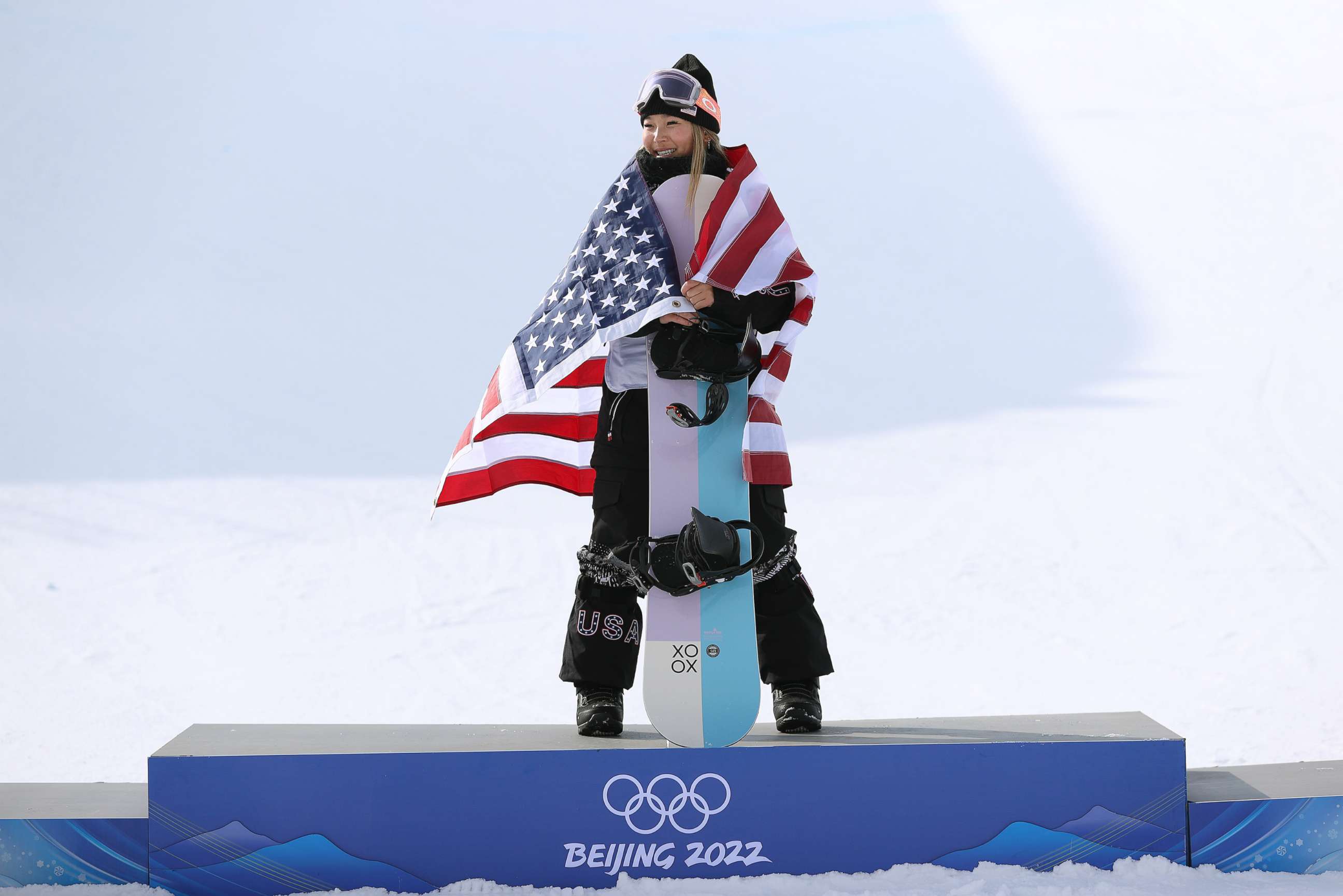 PHOTO: Gold medallist Chloe Kim of Team USA celebrates during the women's snowboard halfpipe final flower ceremony at the Beijing 2022 Winter Olympics at Genting Snow Park on Feb. 10, 2022, in Zhangjiakou, China.