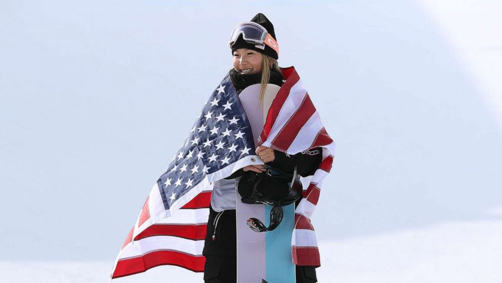 PHOTO: Gold medallist Chloe Kim of Team USA celebrates during the women's snowboard halfpipe final flower ceremony at the Beijing 2022 Winter Olympics at Genting Snow Park on Feb. 10, 2022, in Zhangjiakou, China.