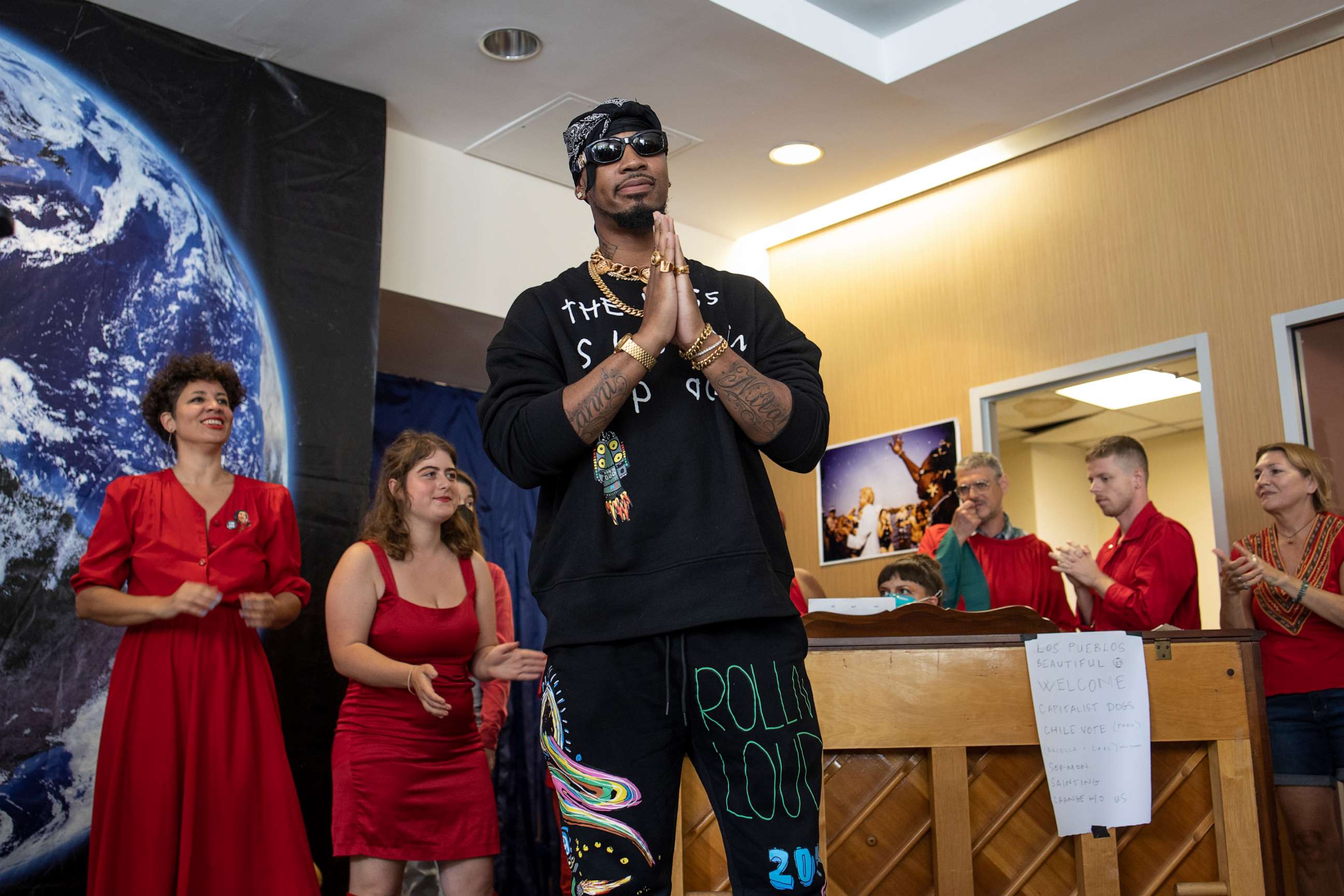 PHOTO: Chris Smalls, leader in the movement to unionize shipping facilities owned by Amazon, receives a tribute on Labor Day for his efforts at the Earth Church, a gathering space for environmental activists, on Sept. 4, 2022, in New York City.