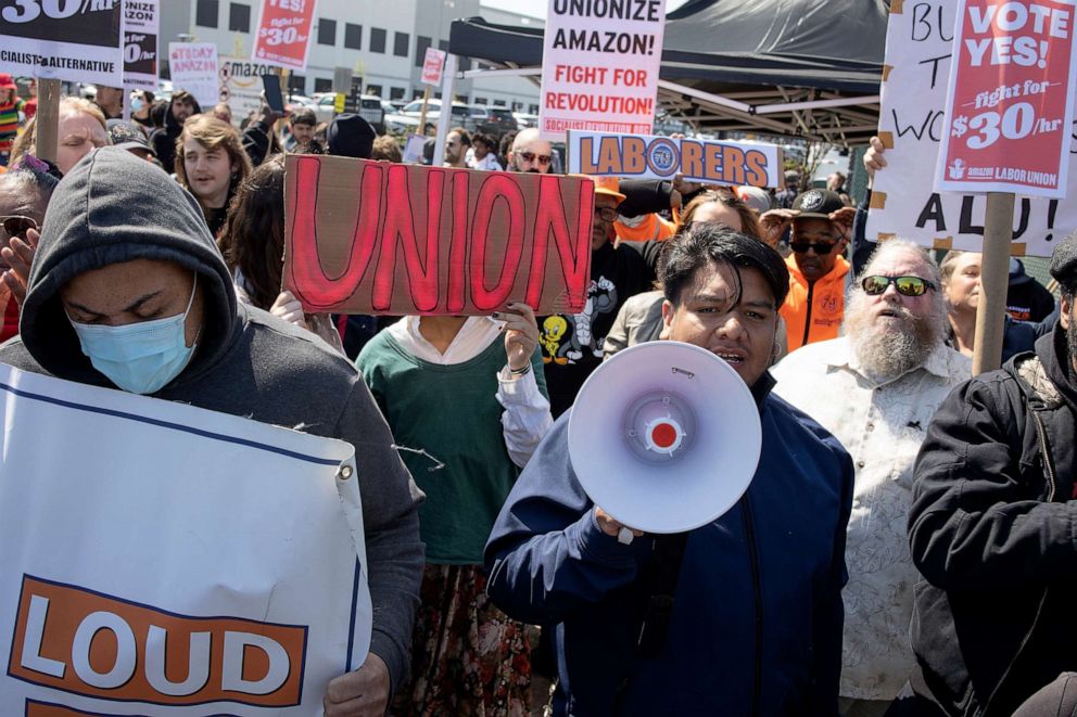 PHOTO: Supporters of Amazon workers attempting to win a second union election at the LDJ5 Amazon Sort Center join a rally in support of the union on April 24, 2022 in Staten Island, New York.