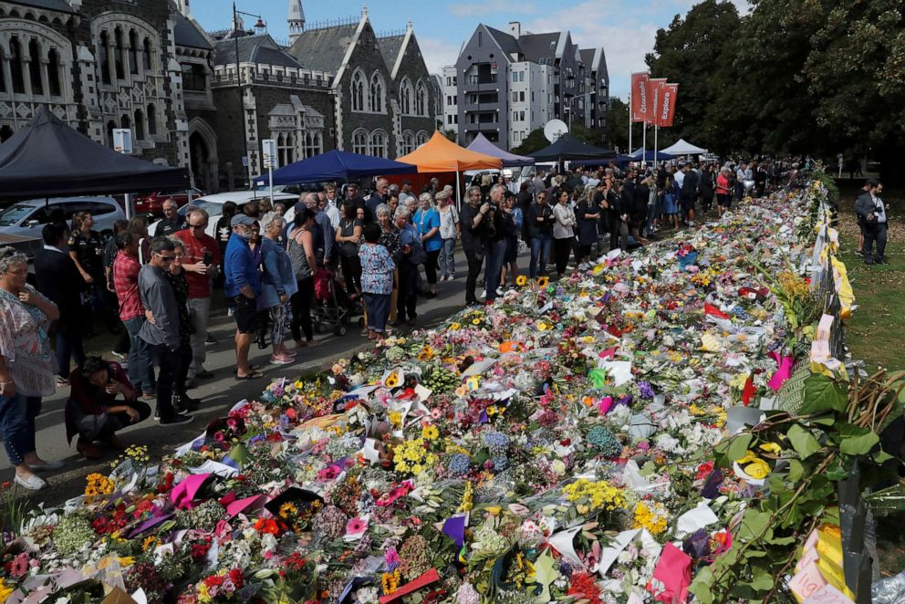 PHOTO: People visit a memorial site for victims of Friday's shooting, in front of Christchurch Botanic Gardens in Christchurch, New Zealand, March 19, 2019.