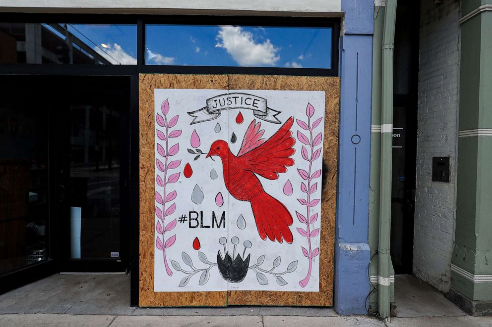 PHOTO: A mural on the covering of a window of a business is shown in downtown Cincinnati as they show support for the Black Lives Matter movement, June 6, 2020.