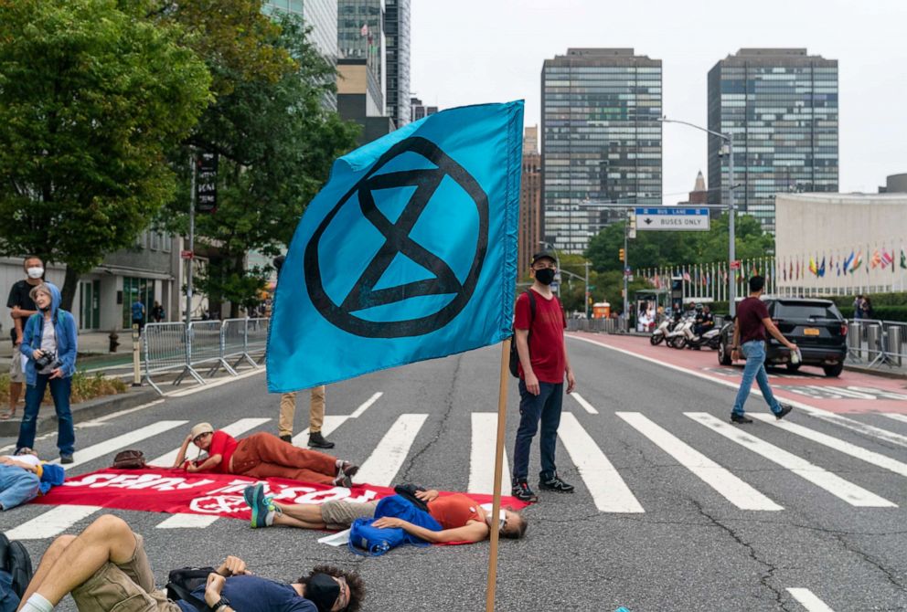 PHOTO: Members of Extinction Rebellion stage protest against companies supporting oil, gas and minerals extractions from Earth to mitigate climate change on 1st avenue across from UN Headquarters in New York City, Sept. 17, 2021.
