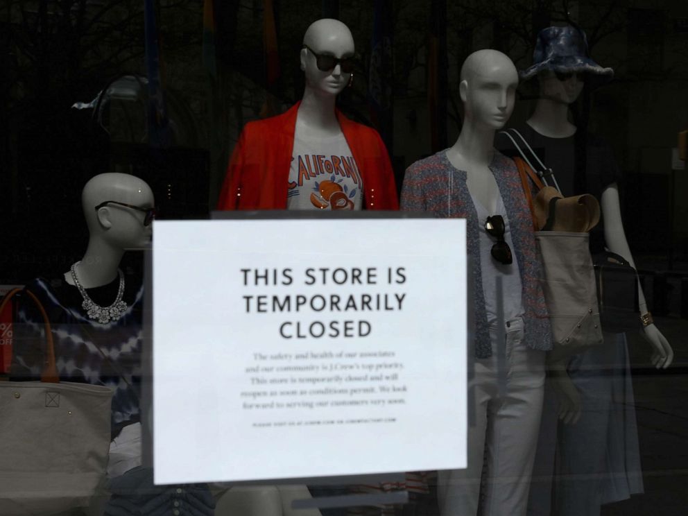 PHOTO: A sign is seen at the window of a closed store near Rockefeller Plaza on May 4, 2020 in New York City.