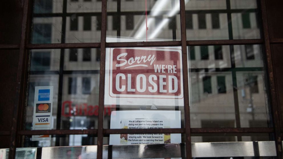 PHOTO: A "closed" sign hangs on the door of Lafayette Coney Island restaurant in Detroit, Michigan, April 4, 2020.