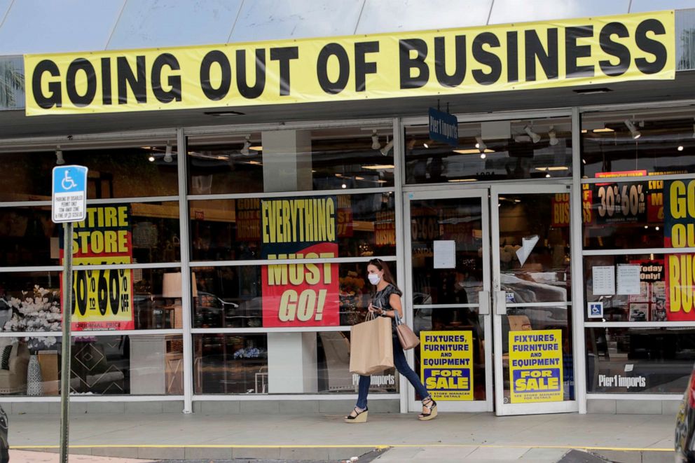 PHOTO: A customer leaves a Pier 1 retail store, which is going out of business, during the coronavirus pandemic in Coral Gables, Fla., Aug. 6, 2020.