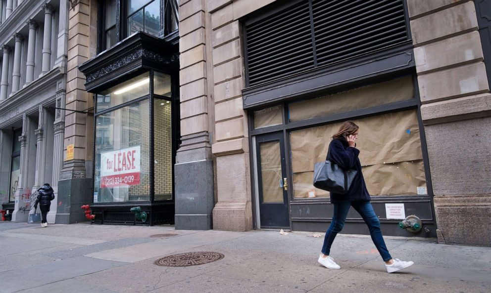 PHOTO: In this Jan. 8, 2021, file photo, a pedestrian walks past closed retail stores in New York.