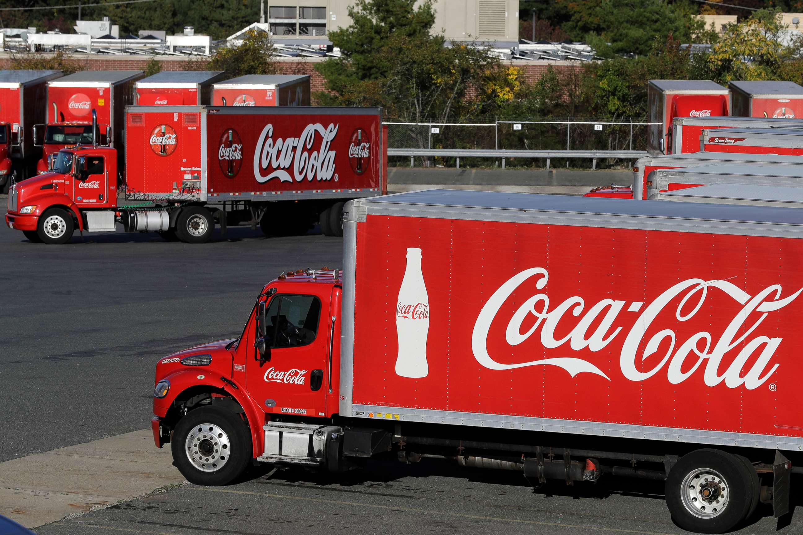 PHOTO: In this Oct. 14, 2019 photo a truck with the Coca-Cola logo is seen in a parking lot at a bottling plant in Needham, Mass.