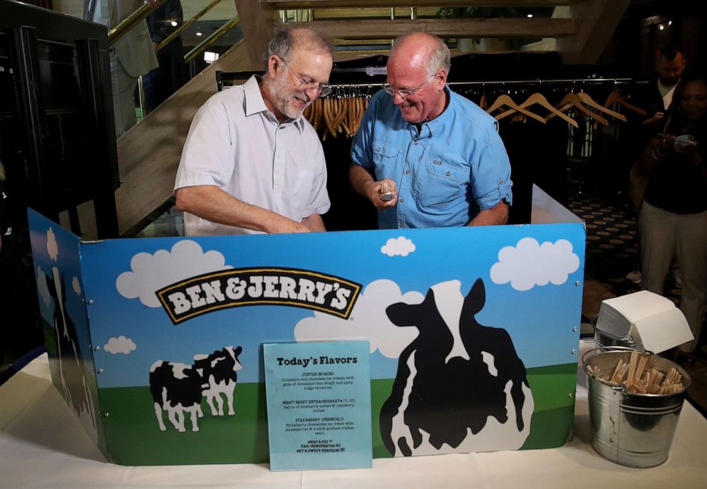 PHOTO: Ben & Jerry's co-founders Ben Cohen, right, and Jerry Greenfield serve ice cream following a press conference announcing a new flavor, Justice Remix'd, September 03, 2019 in Washington, DC.