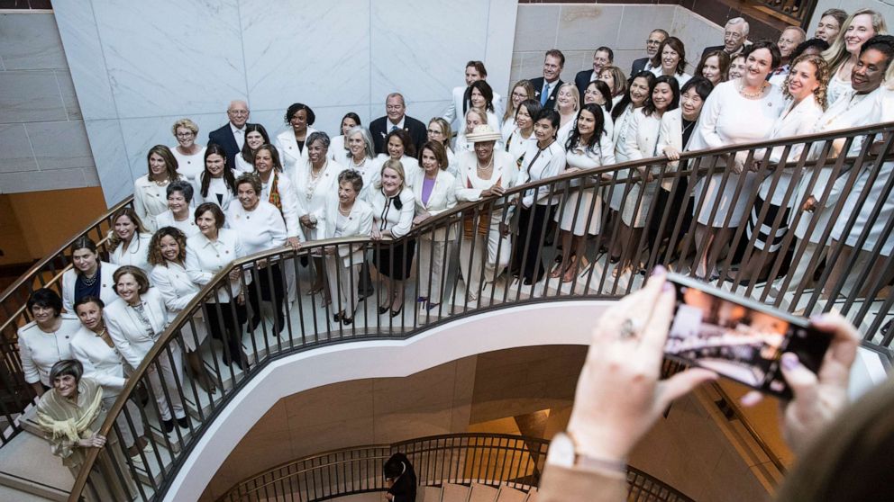 PHOTO: Members of Congress pose for photos while dressed in white to honor suffragettes, on Capitol Hill in Washington, D.C., Feb. 5, 2019.