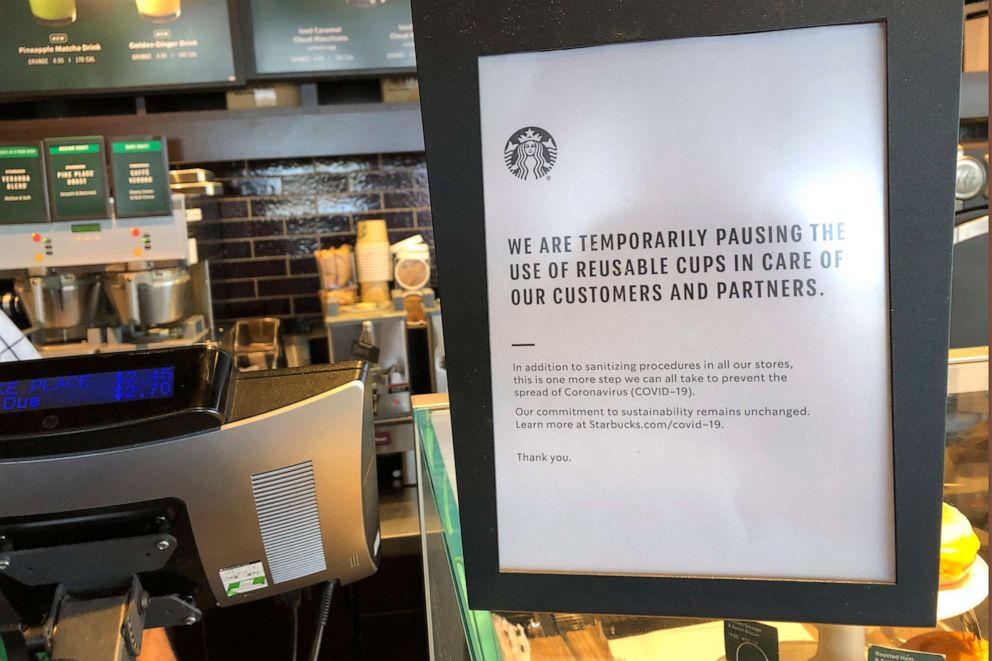 PHOTO: A sign posted at a Starbucks store in Tacoma, Wash., March 5, 2020, tells customers that the coffee company is temporarily stopping accepting reusable cups, as part of efforts to prevent the spread of the COVID-19 coronavirus.