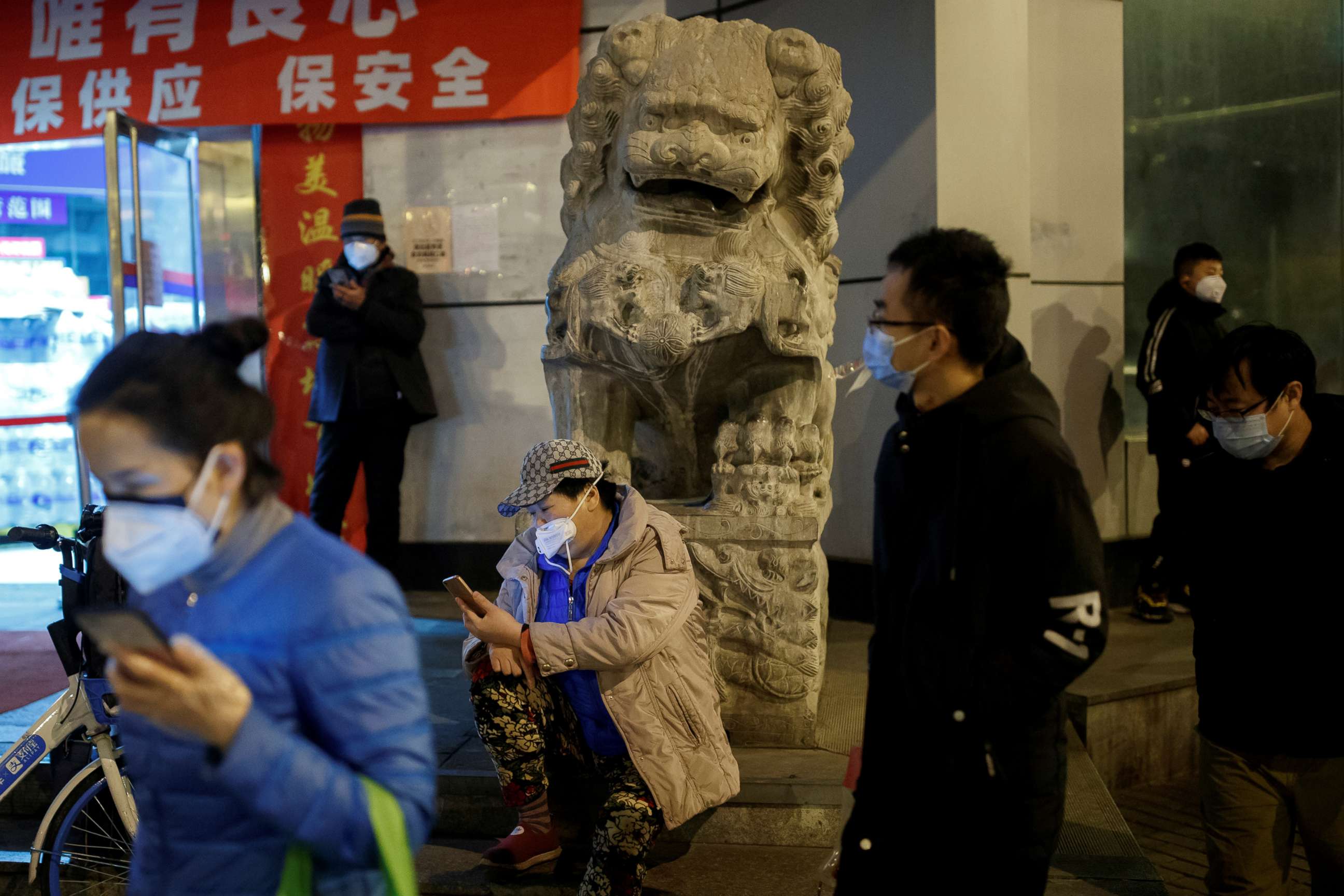 PHOTO:People wear face masks in a street in Beijing as the country is hit by an outbreak of the novel coronavirus, China, Feb. 26, 2020.