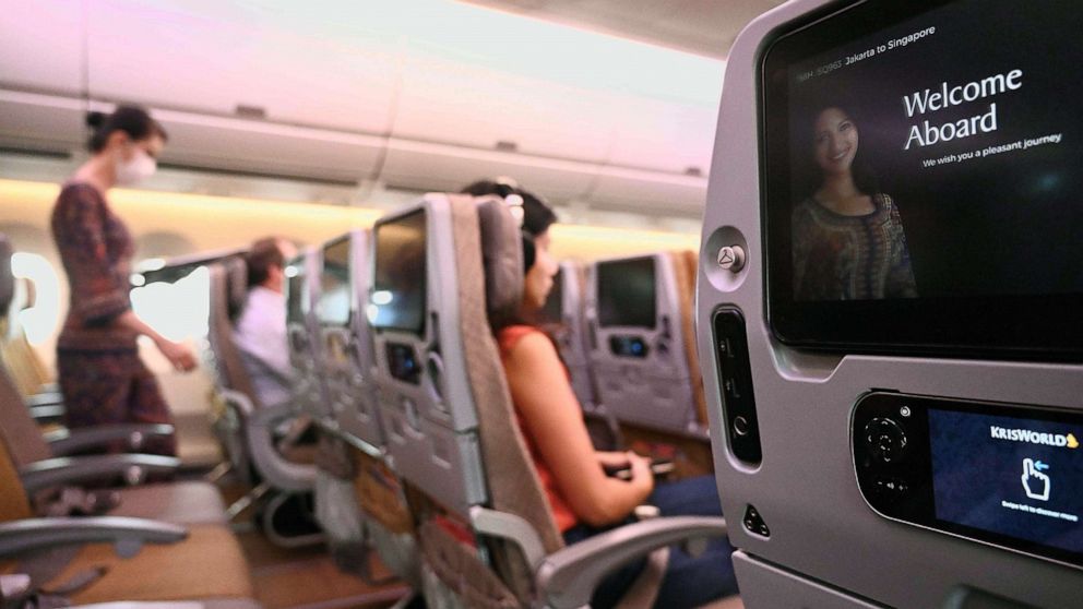 PHOTO: A row of empty seats are seen on board a commercial flight to Singapore from Jakarta International Airport, before the aircraft's departure, Feb. 18, 2020.