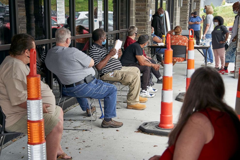 PHOTO: Job seekers exercise social distancing as they wait to be called into the Heartland Workforce Solutions office in Omaha, Neb., July 15, 2020.
