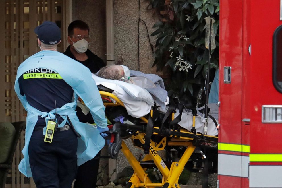 PHOTO: A patient is loaded into an ambulance, March 10, 2020, at the Life Care Center in Kirkland, Wash., near Seattle. 