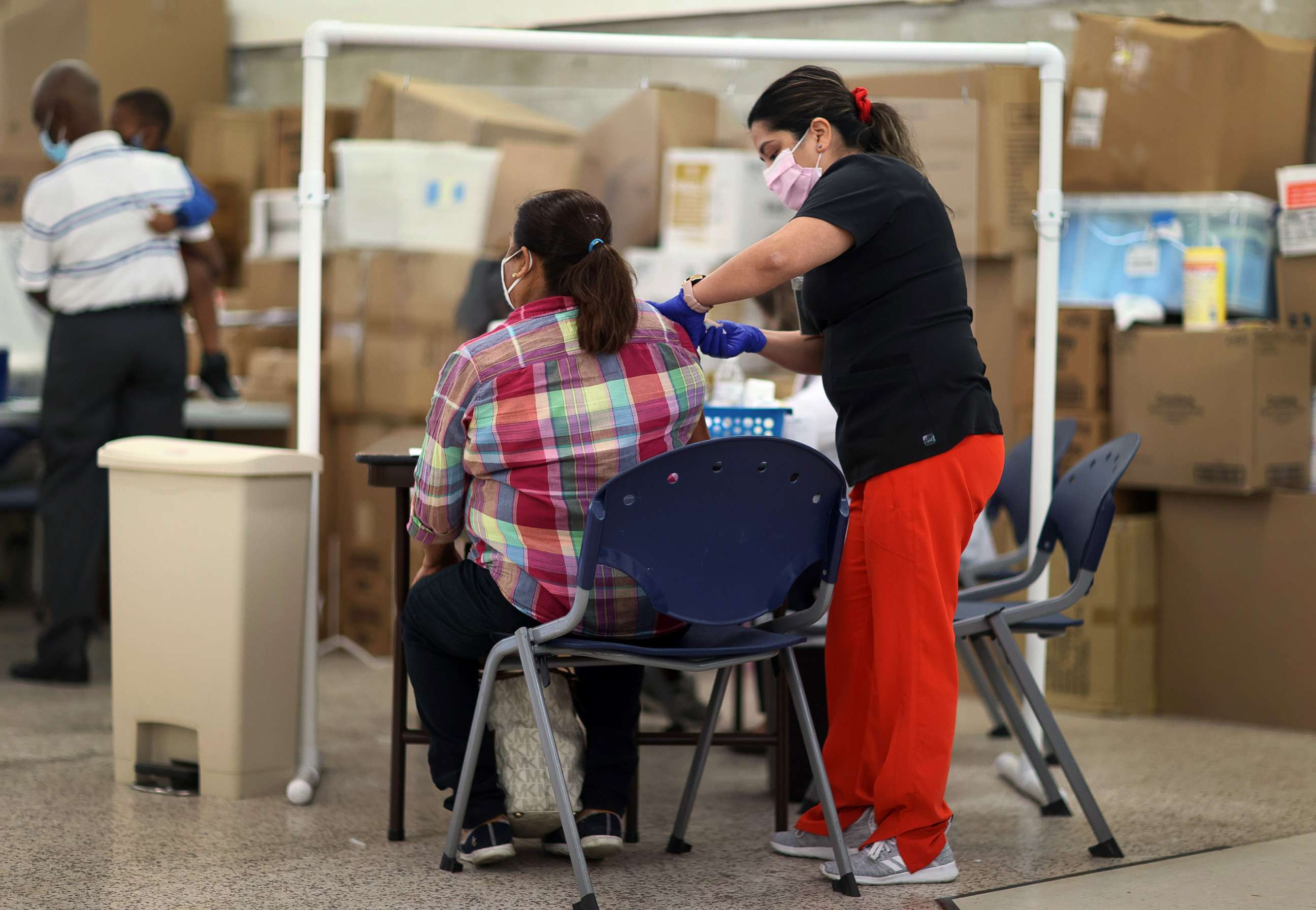 PHOTO: Anna Mendez, LPN, administers a Moderna COVID-19 vaccine at a clinic set up by Healthcare Network on May 20, 2021 in Immokalee, Fla.