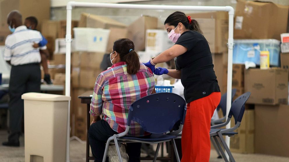 PHOTO: Anna Mendez, LPN, administers a Moderna COVID-19 vaccine at a clinic set up by Healthcare Network on May 20, 2021 in Immokalee, Fla.
