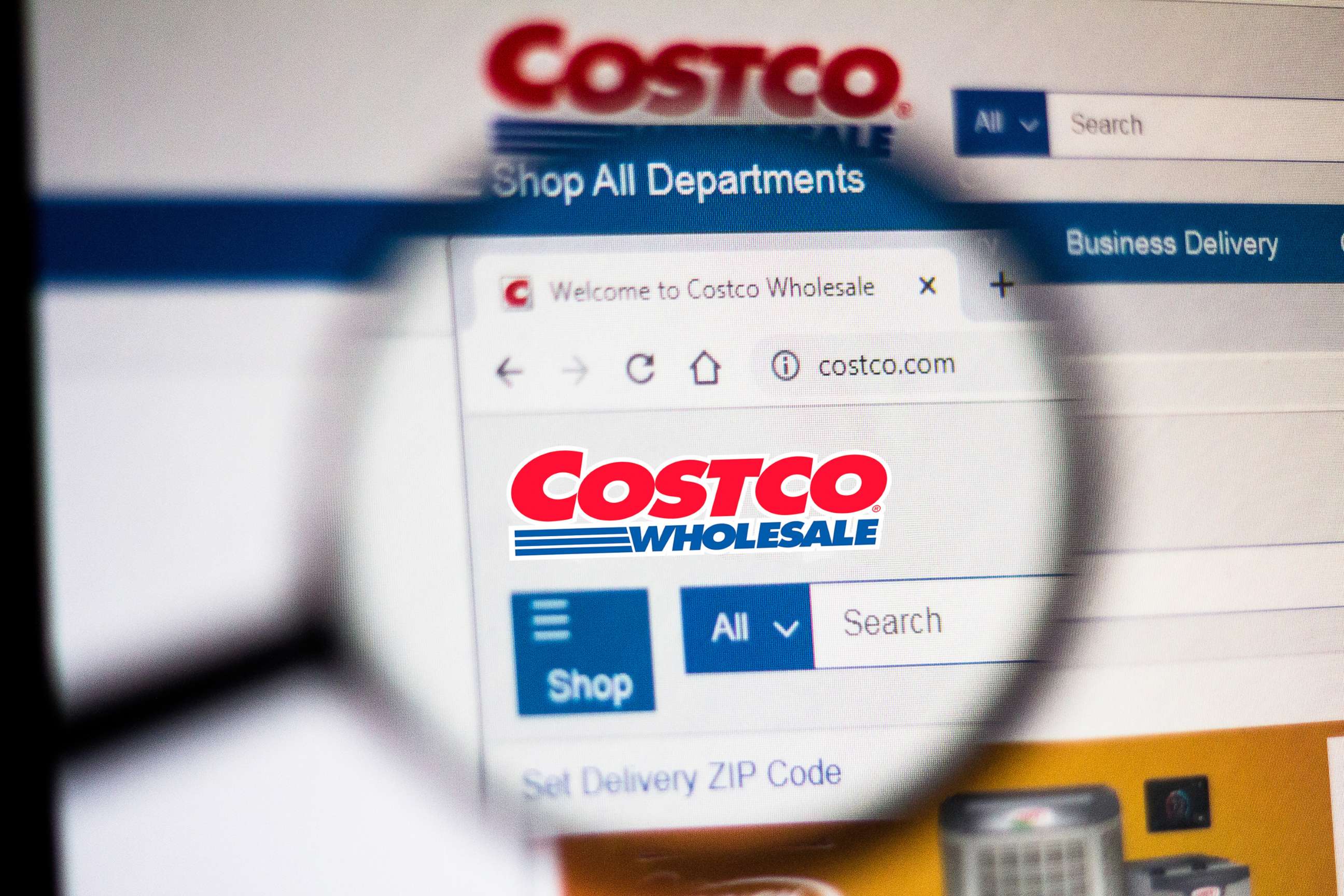 PHOTO: In this photo illustration the homepage of the Costco Wholesale Corporation website is seen displayed on a computer screen through a magnifying glass on Nov. 5, 2019.