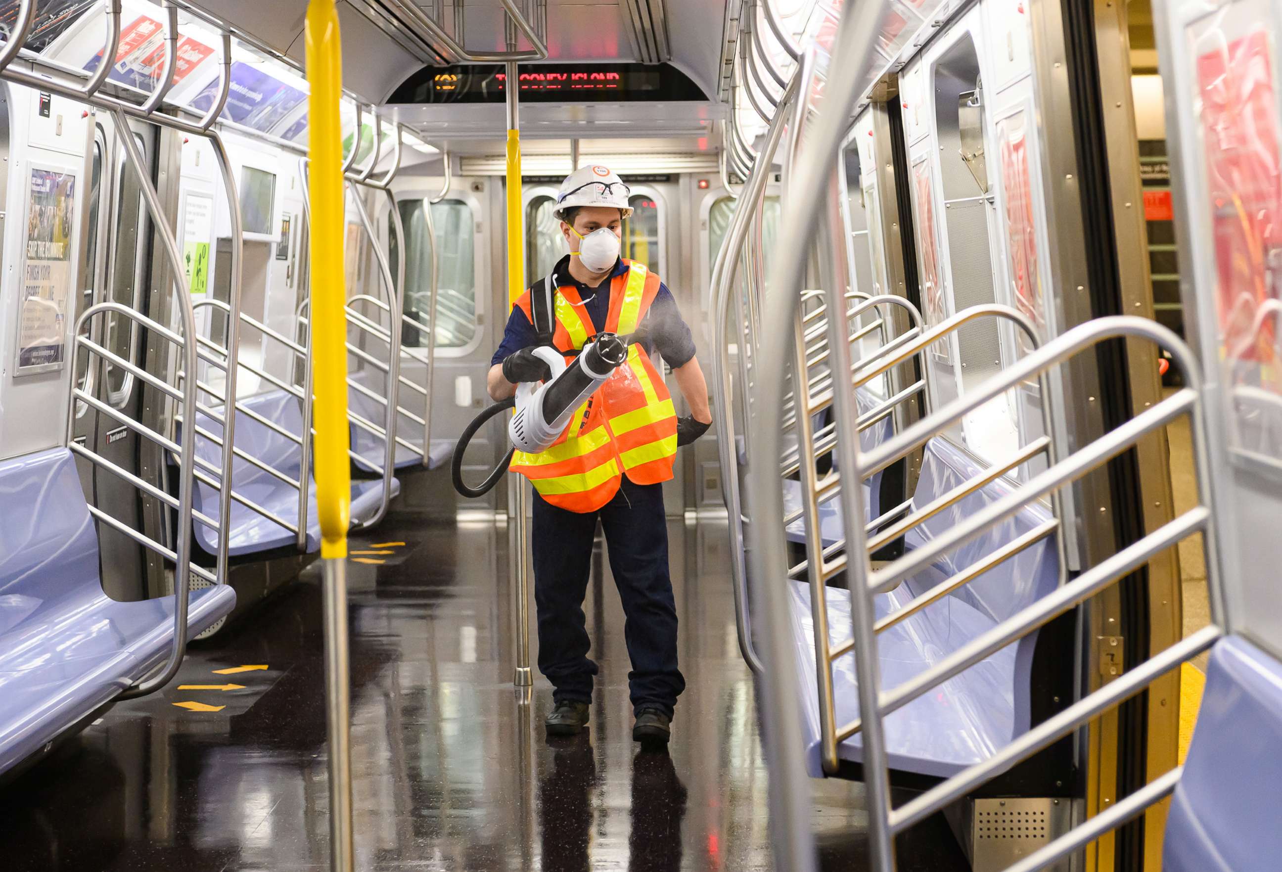 PHOTO: In this May 23 ,2020, file photo, an MTA cleaning contractor sprays Shockwave RTU disinfectant inside a New York City subway car on the Upper East Side during the coronavirus pandemic in New York.