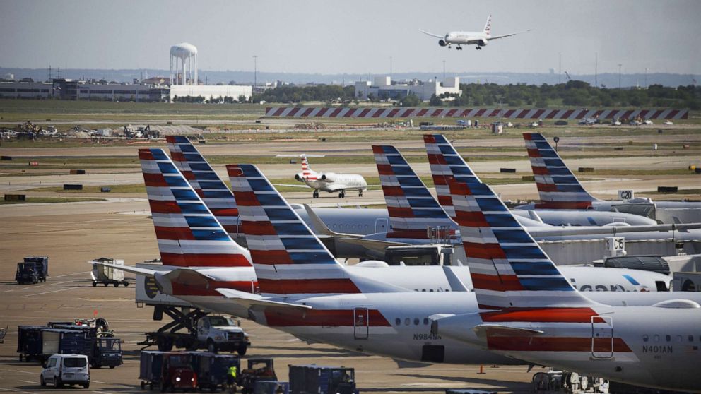 PHOTO: American Airlines Group Inc. airplanes stand at passenger gates at Dallas/Fort Worth International Airport (DFW) near Dallas, Texas, on Oct. 1, 2020.