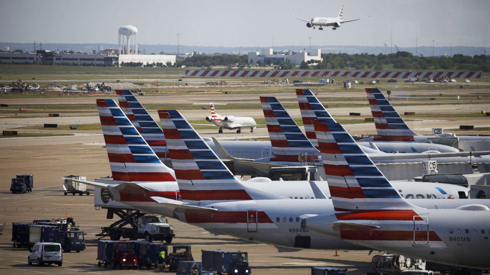 PHOTO: American Airlines Group Inc. airplanes stand at passenger gates at Dallas/Fort Worth International Airport (DFW) near Dallas, Texas, on Oct. 1, 2020.