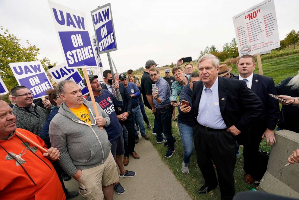 PHOTO: Agriculture Secretary Tom Vilsack talks with members of the United Auto Workers outside of a John Deere plant, Oct. 20, 2021, in Ankeny, Iowa. About 10,000 UAW workers have gone on strike against John Deere at plants in Iowa, Illinois and Kansas.