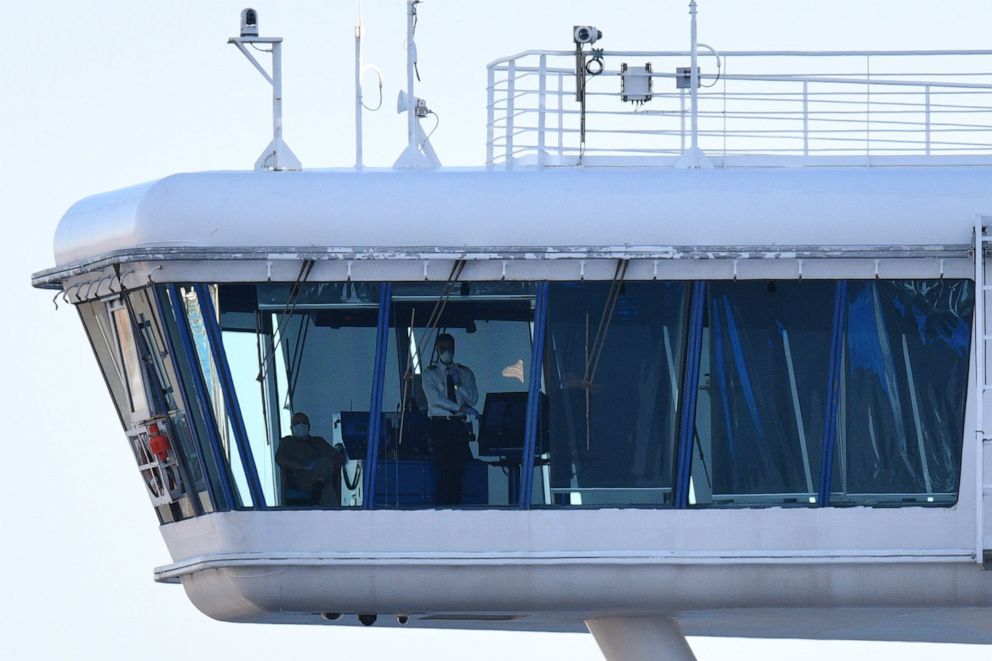 PHOTO: Crew members aboard the Diamond Princess cruise ship are seen at its wheelhouse at the Daikoku Pier Cruise Terminal in Yokohama port in Japan, Feb. 27, 2020.